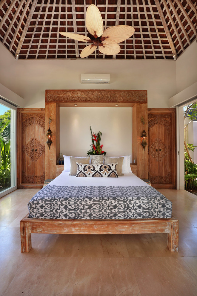 Photo of a mid-sized tropical bedroom in Other.