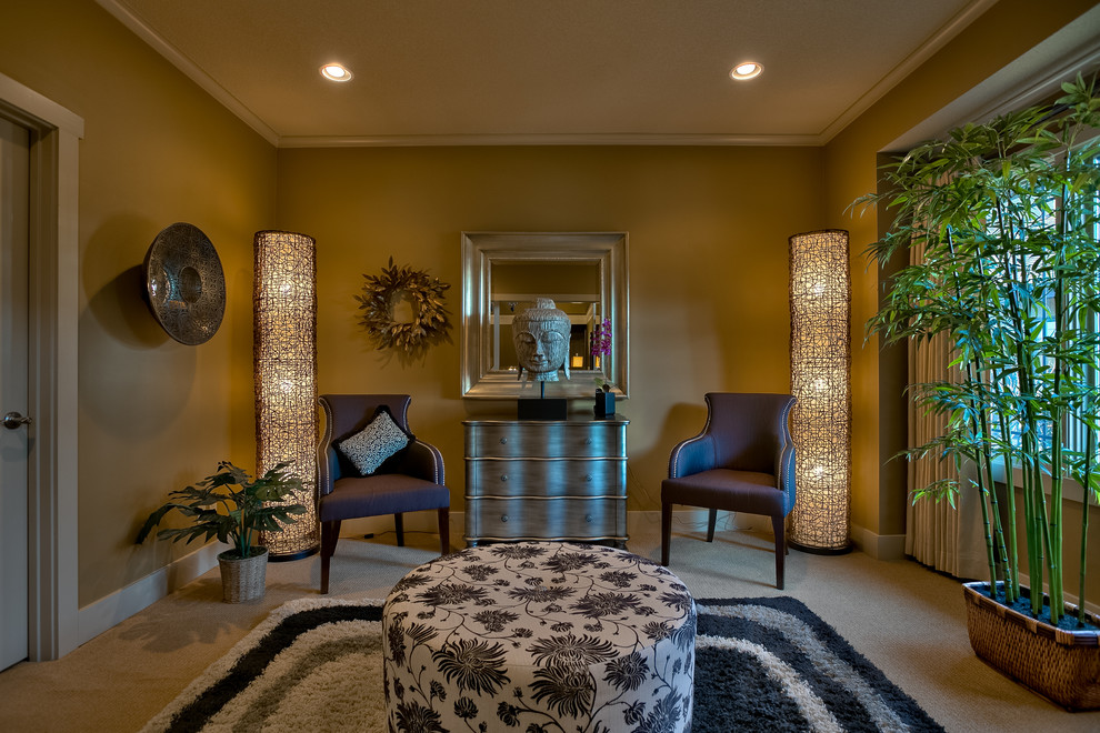 This is an example of an asian formal enclosed living room in Kansas City with brown walls, carpet and no fireplace.