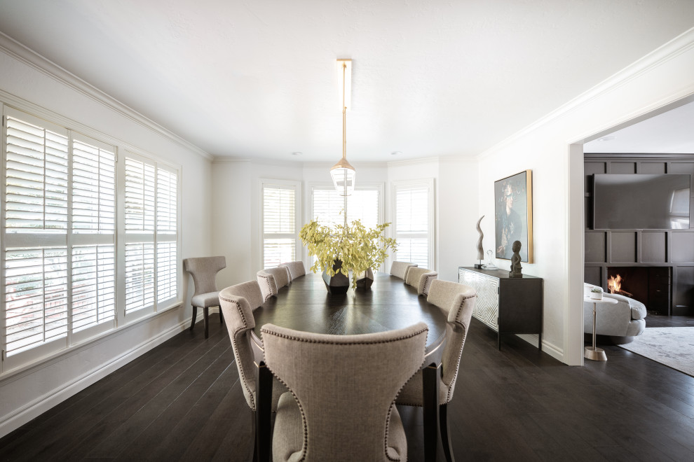 Design ideas for a medium sized classic dining room in Oklahoma City with white walls, dark hardwood flooring and black floors.