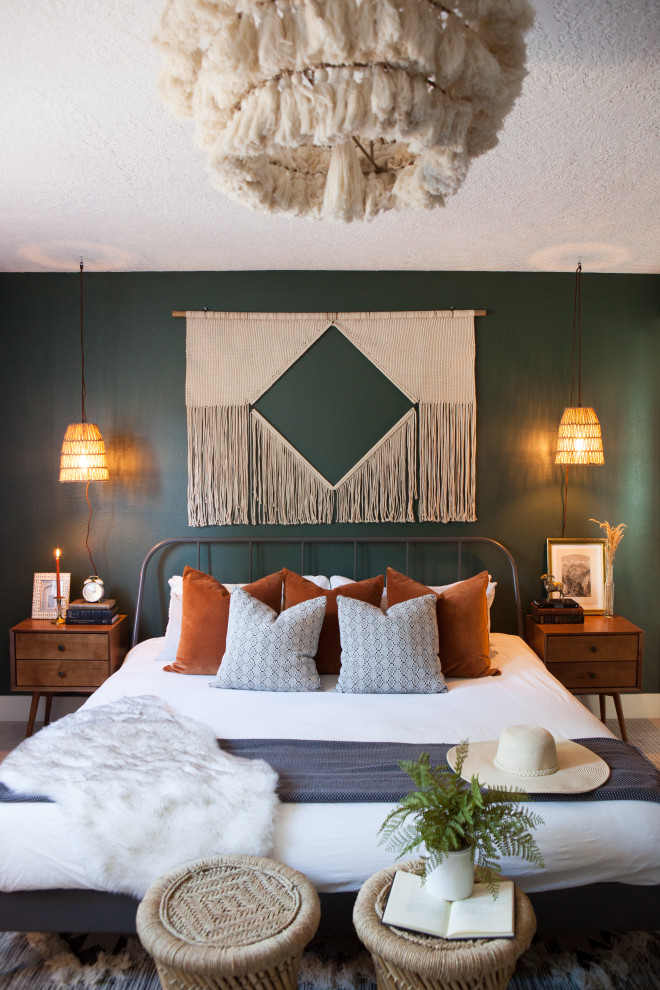 Eclectic master bedroom in Portland with green walls.