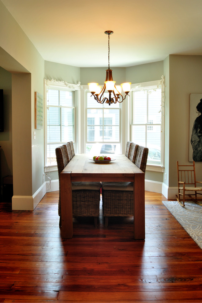 This is an example of a mid-sized traditional separate dining room in New York with grey walls, light hardwood floors and no fireplace.