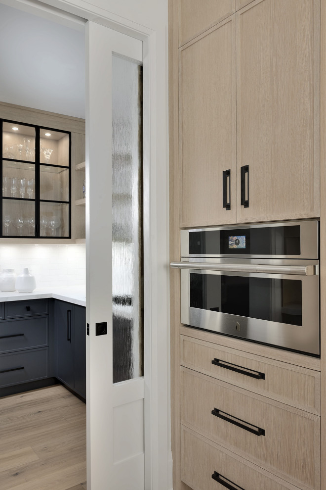 Example of a transitional kitchen design in Toronto