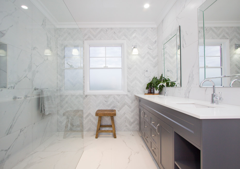Photo of a transitional master bathroom in Brisbane with shaker cabinets, grey cabinets, a curbless shower, white walls, an undermount sink, white floor, an open shower and white benchtops.
