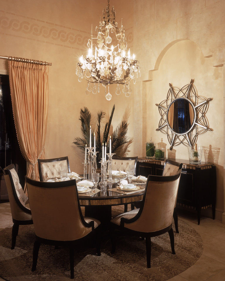 Photo of a large mediterranean separate dining room in Tampa with beige walls, travertine floors, no fireplace and beige floor.