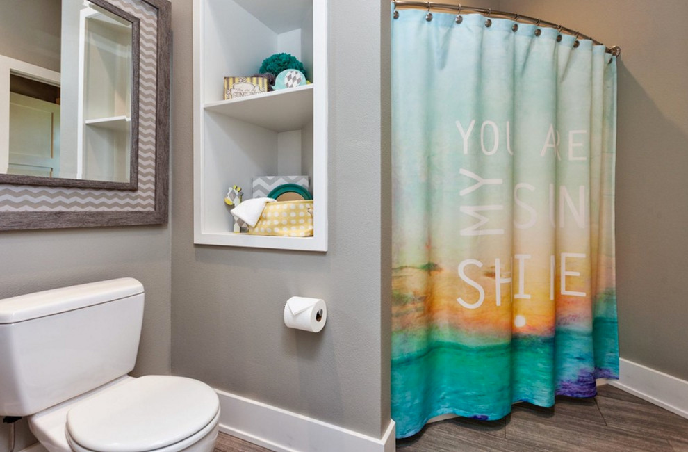 Inspiration for a mid-sized transitional 3/4 brown tile, gray tile and porcelain tile porcelain tile alcove shower remodel with a two-piece toilet and gray walls