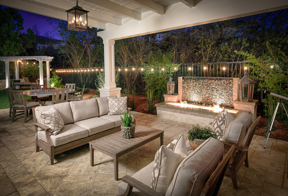 Inspiration for a small traditional backyard patio in San Diego with concrete pavers and a pergola.