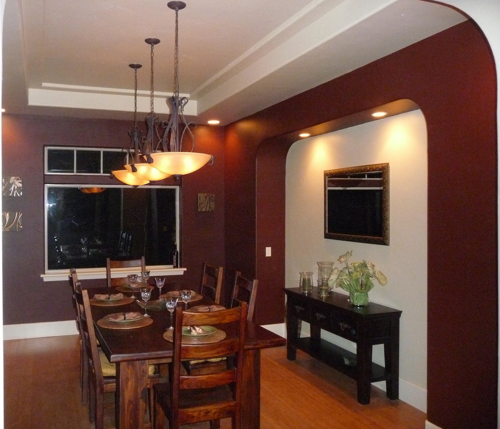 Design ideas for a country dining room in Sacramento with red walls and bamboo floors.