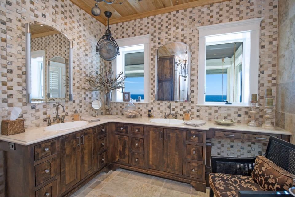Mid-sized mountain style master beige tile and ceramic tile limestone floor and beige floor bathroom photo in Miami with flat-panel cabinets, dark wood cabinets, beige walls, a drop-in sink and quartz countertops