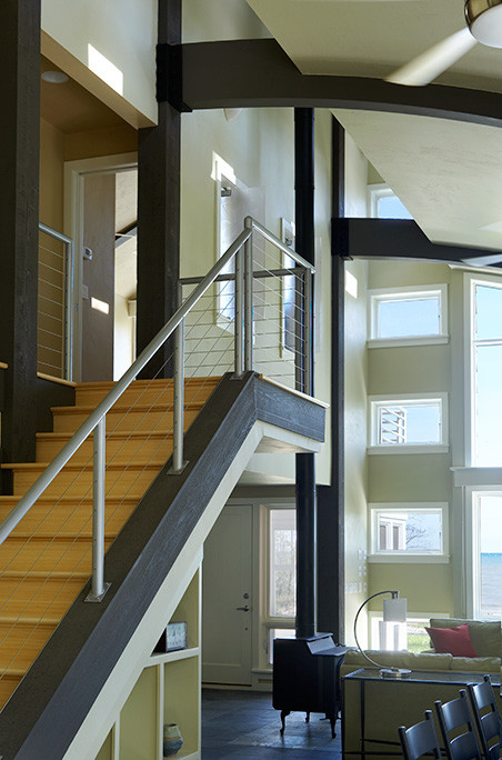 Design ideas for a mid-sized modern wood floating staircase in Chicago with wood risers.