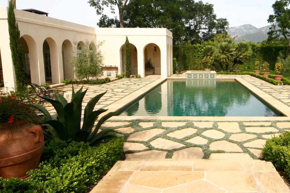 Inspiration for a mediterranean rectangular lap pool in Other with a hot tub.