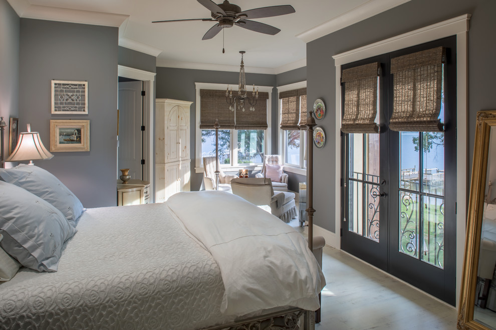 Inspiration for a traditional bedroom in Charlotte with grey walls and beige floor.