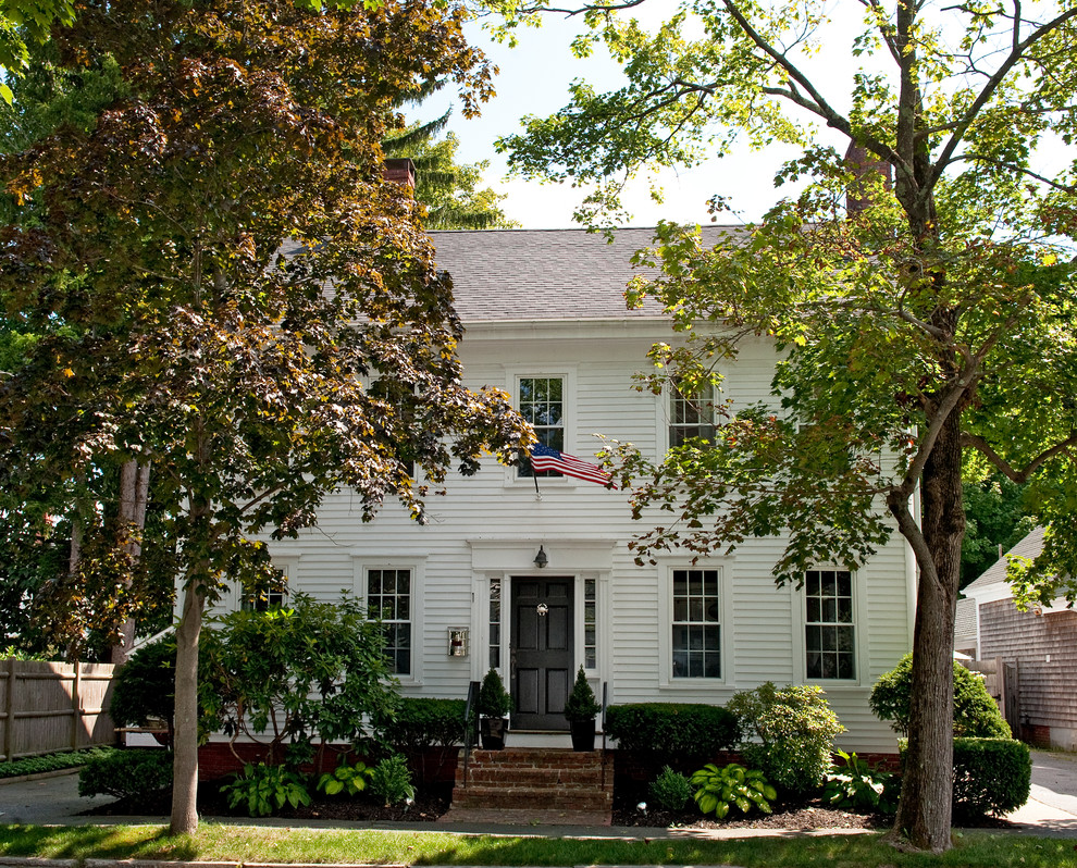 Mid-sized traditional two-storey white exterior in Boston with wood siding.