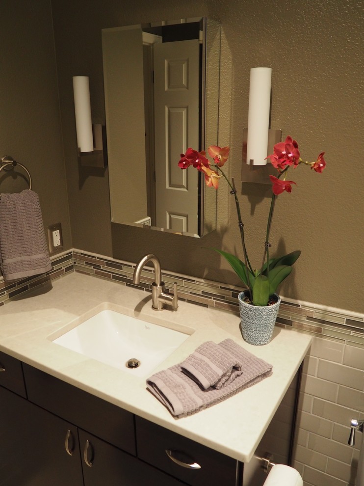 Mid-sized transitional 3/4 gray tile and ceramic tile porcelain tile alcove bathtub photo in Denver with an undermount sink, flat-panel cabinets, brown cabinets, quartz countertops, a one-piece toilet and beige walls