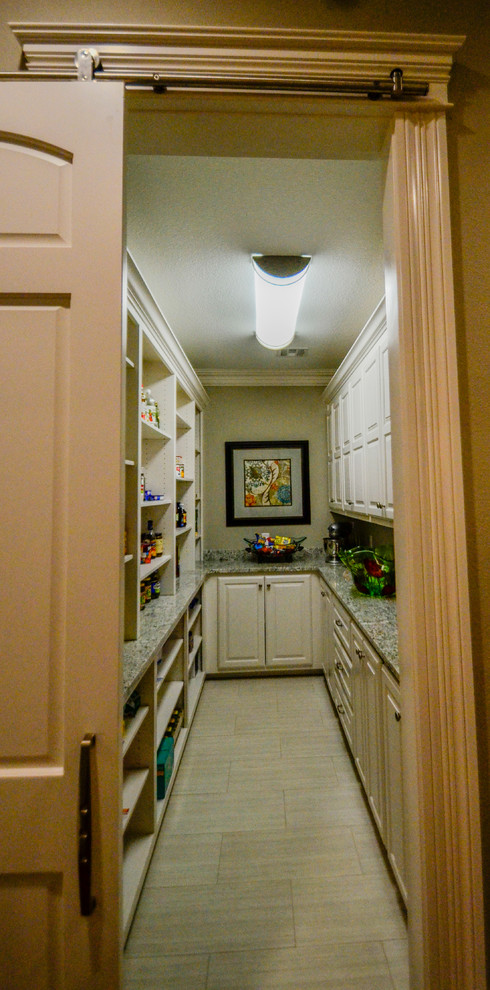 Example of a large transitional u-shaped dark wood floor open concept kitchen design with a double-bowl sink, raised-panel cabinets, white cabinets, granite countertops, gray backsplash, stainless steel appliances and an island