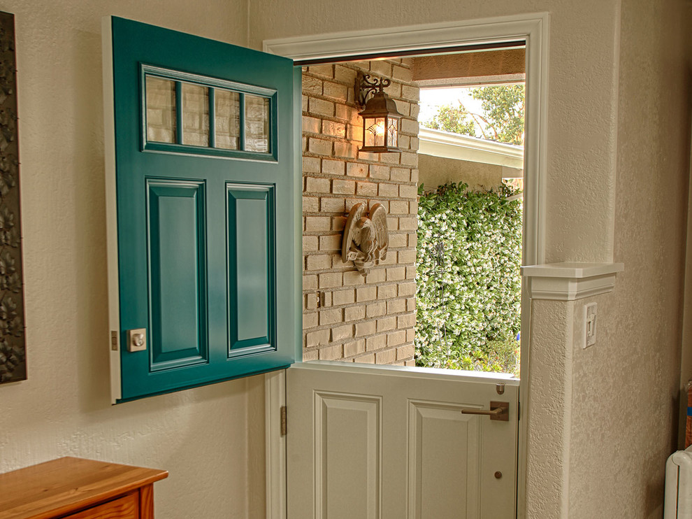 Mid-sized traditional front door in Orange County with brown walls, a dutch front door and a green front door.