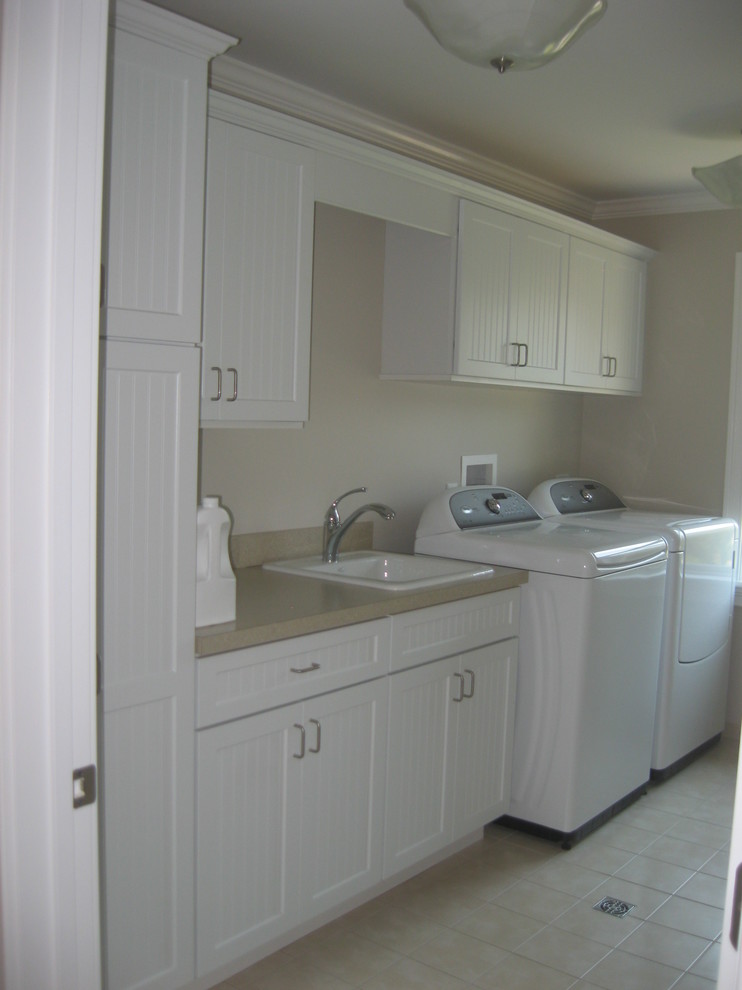 Beach style laundry room in New York.