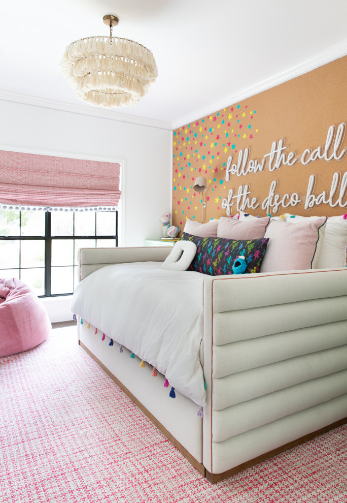 Mid-sized contemporary gender-neutral kids' bedroom in Austin with medium hardwood floors and multi-coloured walls.