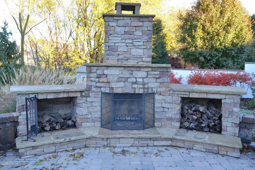 Design ideas for a large arts and crafts backyard patio in Kansas City with a fire feature, concrete pavers and no cover.