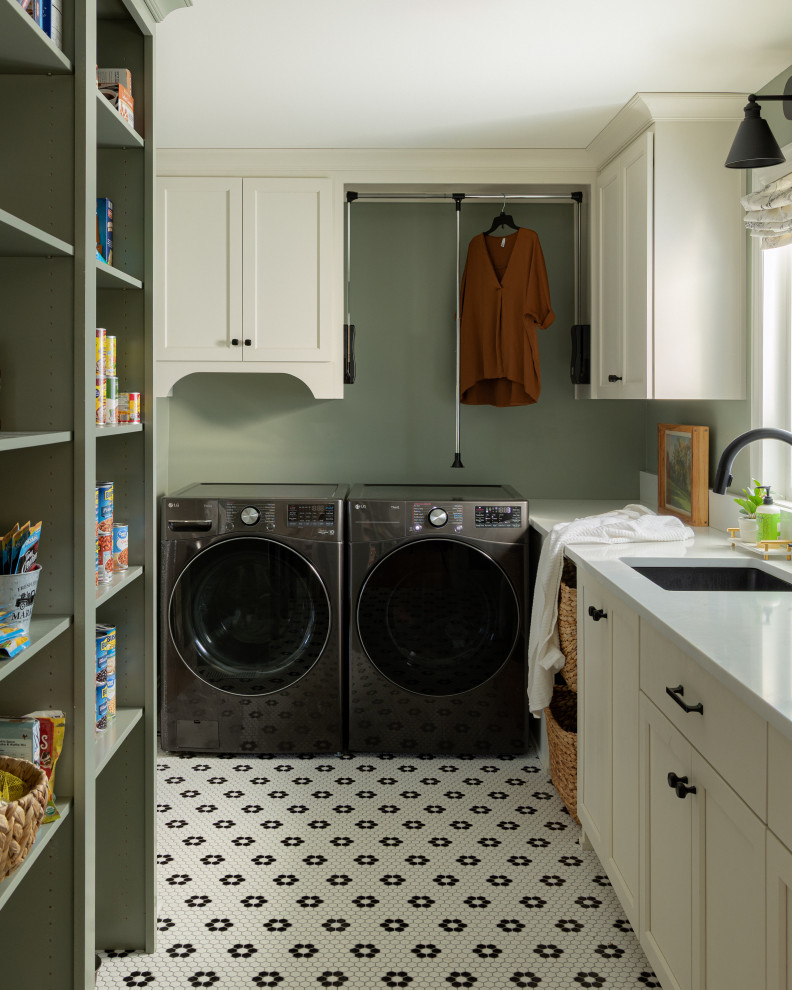 Inspiration for a transitional l-shaped multicolored floor laundry room remodel in Louisville with an undermount sink, shaker cabinets, white cabinets, green walls, a side-by-side washer/dryer and white countertops