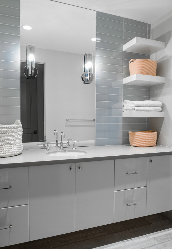 Inspiration for a contemporary kids bathroom in Phoenix with flat-panel cabinets, grey cabinets, an urinal, white tile, glass tile, white walls, porcelain floors, an undermount sink, engineered quartz benchtops, white floor and white benchtops.