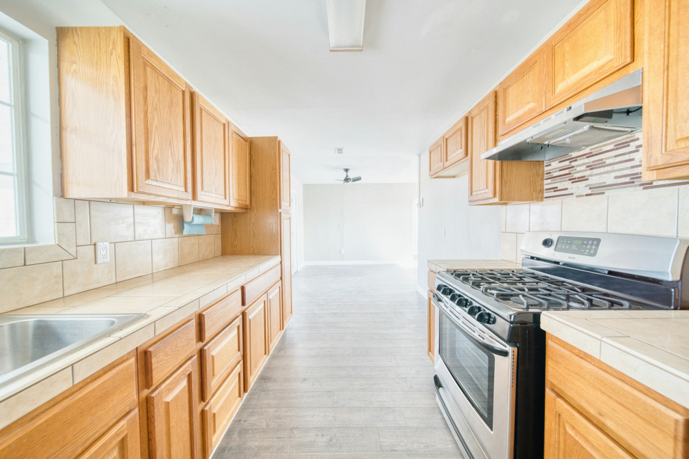 A kitchen with hanging drawers