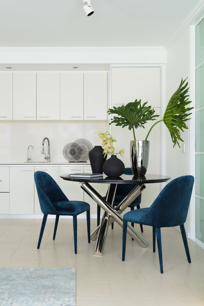This is an example of a contemporary dining room in Sydney.