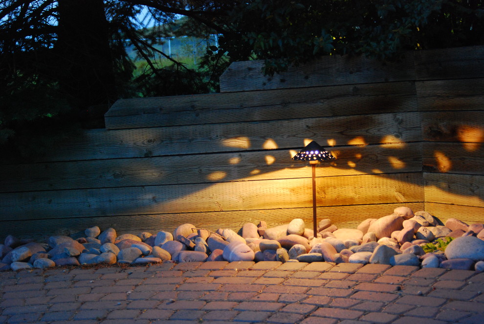 Design ideas for a mid-sized rustic front yard brick garden path in Calgary.