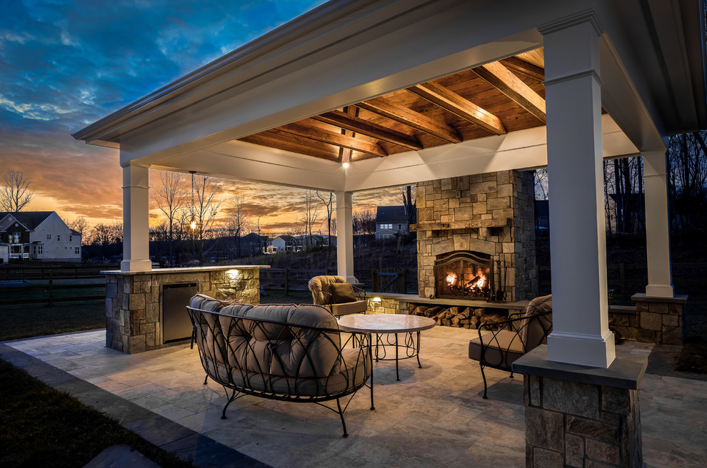 Inspiration for a country backyard patio in DC Metro with a gazebo/cabana and with fireplace.