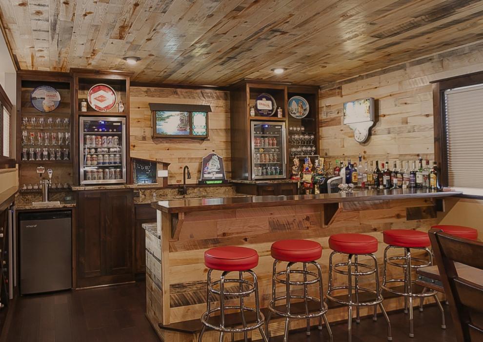 This is an example of a mid-sized modern u-shaped seated home bar in Other with an undermount sink, dark wood cabinets, wood benchtops, laminate floors, multi-coloured floor and brown benchtop.