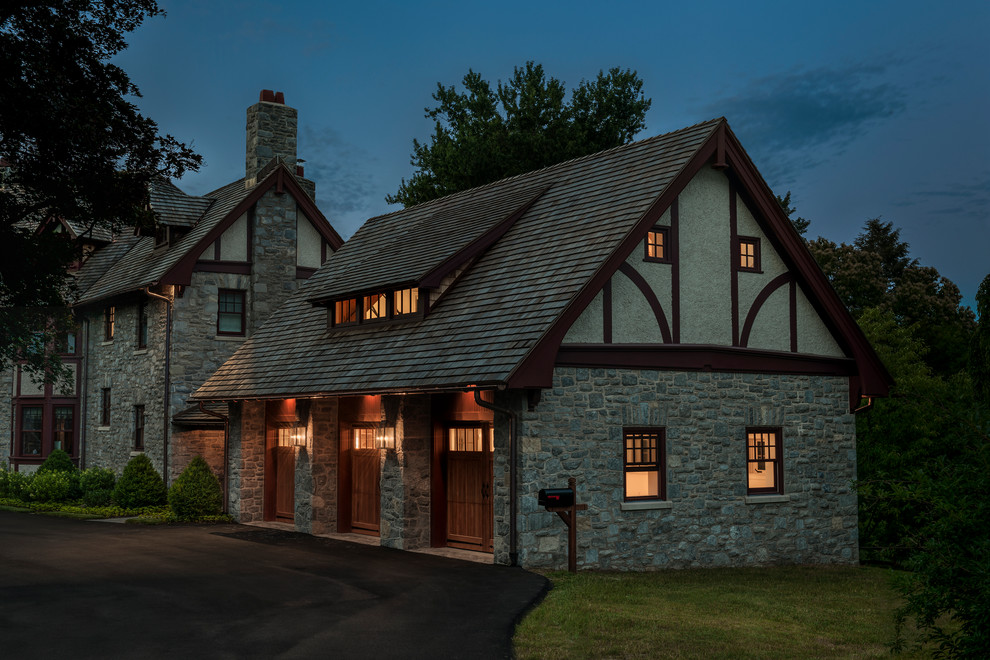This is an example of a large traditional three-car garage in Philadelphia.