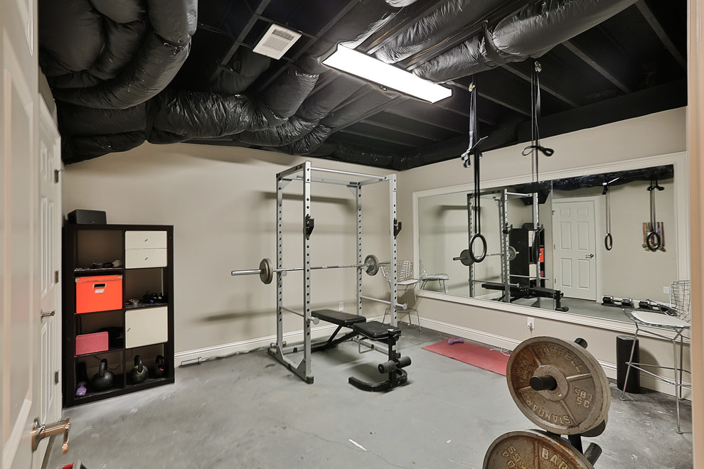 Mid-sized transitional home weight room in Atlanta with grey walls, concrete floors and grey floor.