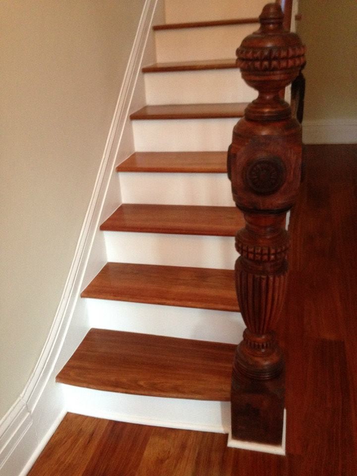 Photo of a mid-sized traditional wood straight staircase in New York with painted wood risers.