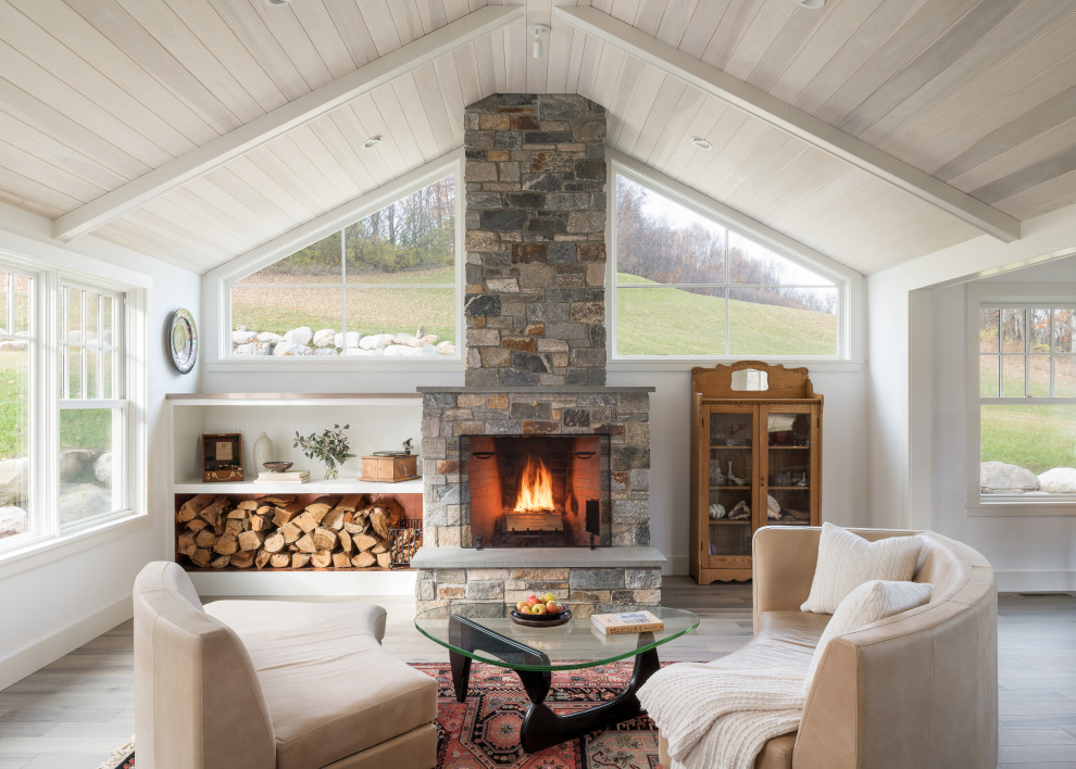 Inspiration for a large country open concept living room in Burlington with a music area, a standard fireplace, a stone fireplace surround and wood.