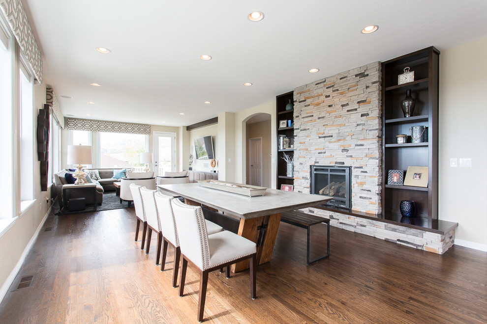 Large transitional l-shaped dark wood floor and brown floor great room photo in Denver with an undermount sink, shaker cabinets, dark wood cabinets, granite countertops, metallic backsplash, glass tile backsplash, stainless steel appliances and an island