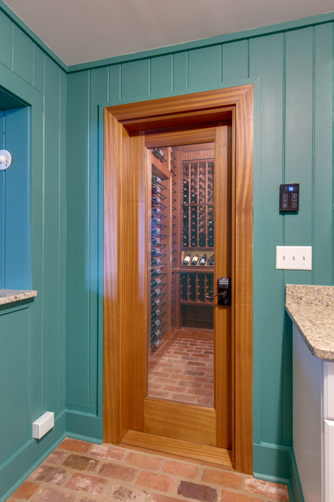 Secret passageway wine cellar. Basement layout with all mahogany racking.