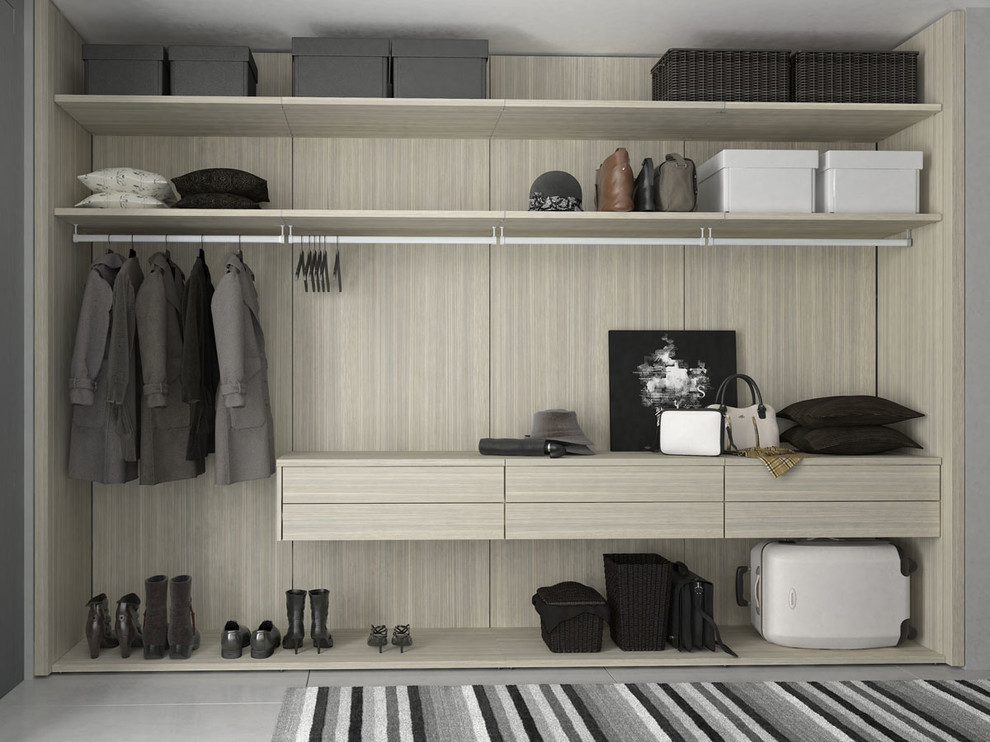 Mid-sized modern walk-in wardrobe in New York with open cabinets and light wood cabinets.