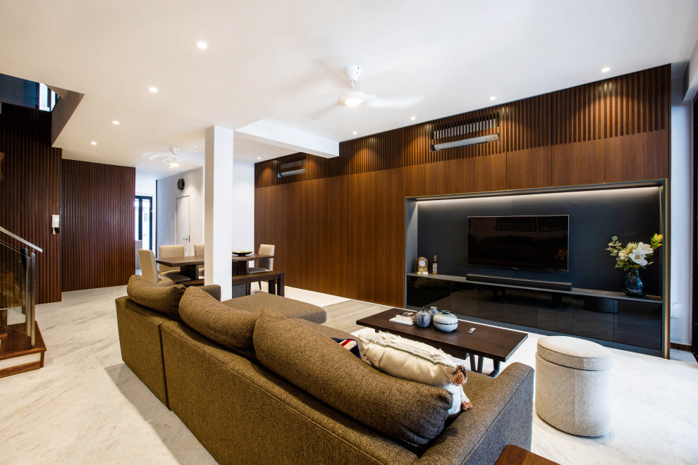 Photo of a large contemporary open concept living room in Singapore with white walls, a built-in media wall and grey floor.