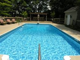 Inspiration for an asian rectangular pool house remodel