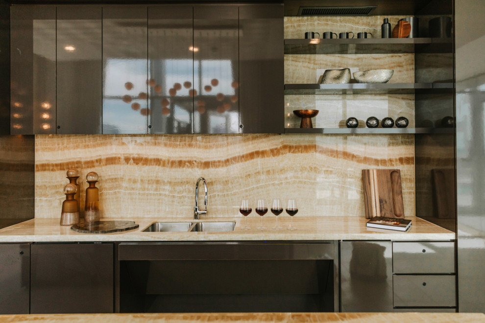 Photo of a mid-sized contemporary eat-in kitchen in Chicago with a double-bowl sink, flat-panel cabinets, brown cabinets, onyx benchtops, stainless steel appliances and with island.