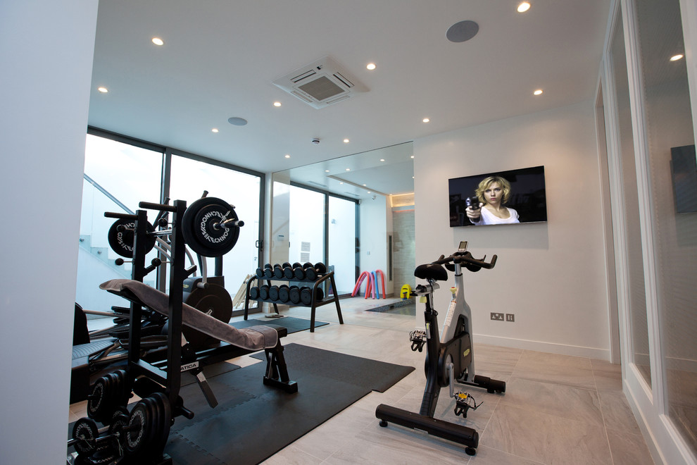 Design ideas for a small contemporary multipurpose gym in London with white walls and ceramic floors.
