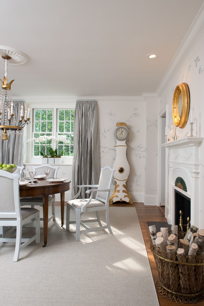 Inspiration for a traditional dining room in Boston with white walls and dark hardwood floors.
