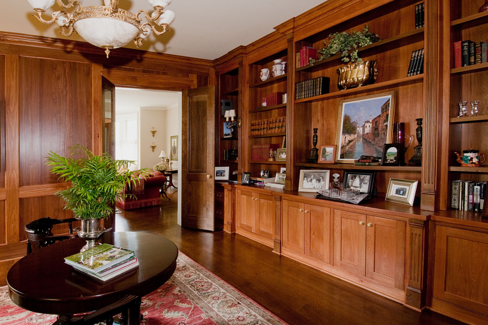 Traditional home office in Chicago with dark hardwood floors.