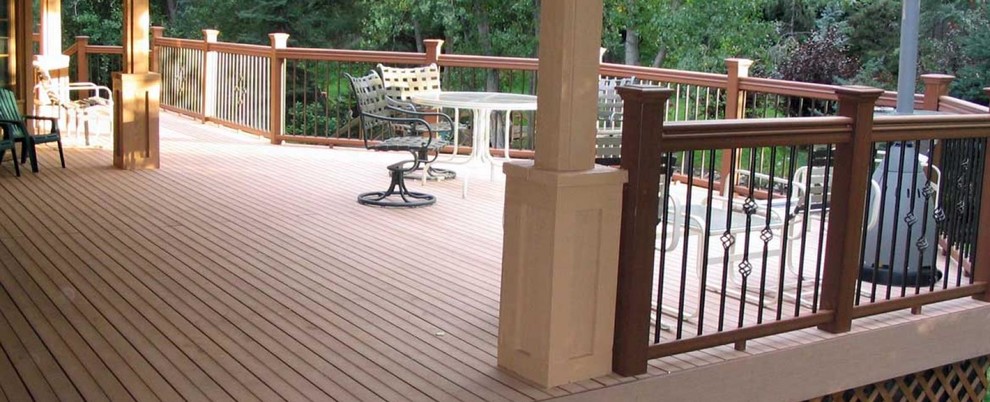 Deck - large transitional backyard deck idea in Denver with a roof extension