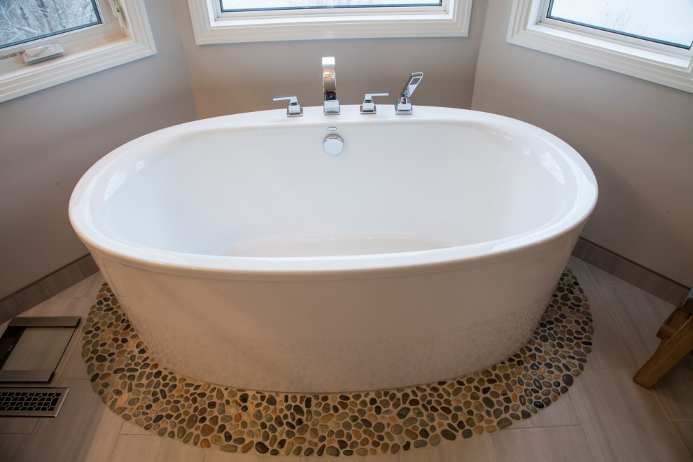 Example of a mid-sized master porcelain tile and beige floor freestanding bathtub design in Edmonton