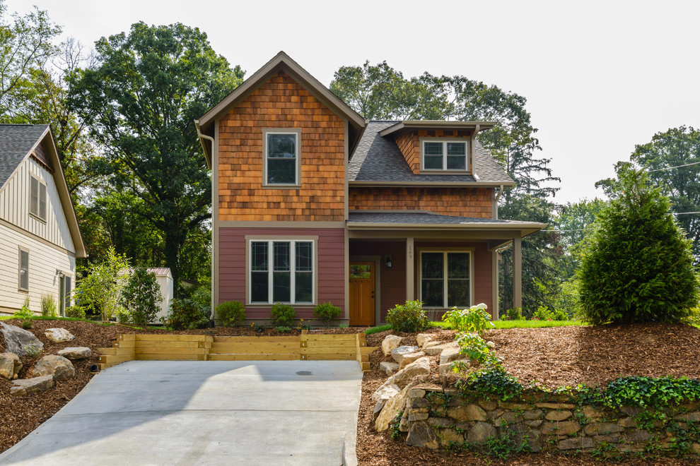 Inspiration for a mid-sized transitional concrete floor and gray floor single front door remodel with red walls and a light wood front door