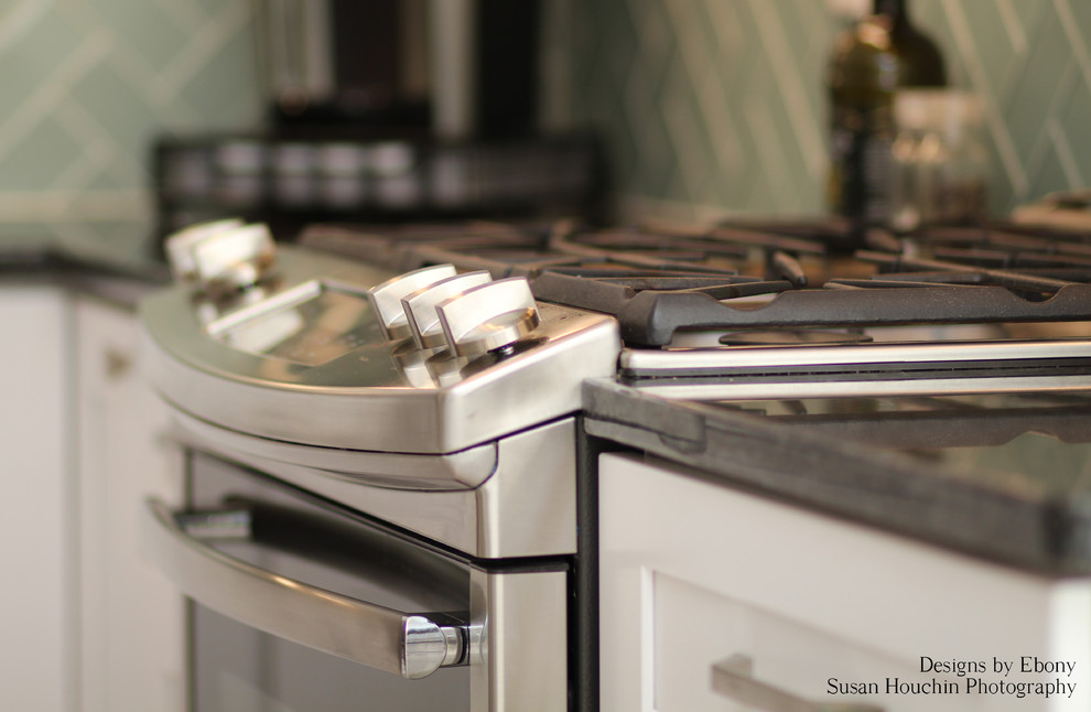 Inspiration for a mid-sized transitional u-shaped vinyl floor and brown floor kitchen remodel with an undermount sink, shaker cabinets, white cabinets, granite countertops, blue backsplash, glass tile backsplash, white appliances and two islands