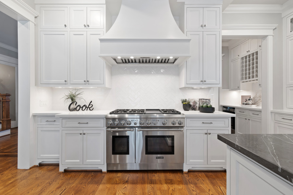 Inspiration for a huge timeless coffered ceiling kitchen remodel in Houston with two islands