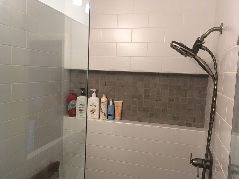 Design ideas for a mid-sized contemporary master bathroom in Minneapolis with shaker cabinets, white cabinets, a freestanding tub, an alcove shower, a bidet, gray tile, ceramic tile, blue walls, ceramic floors and an undermount sink.