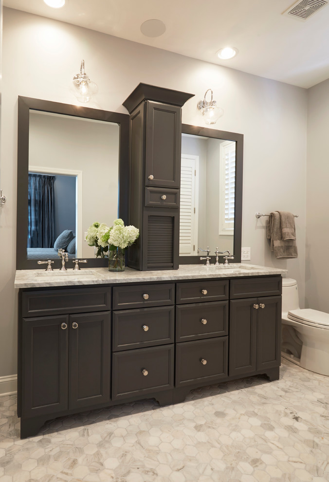 Photo of a mid-sized country master bathroom in Other with flat-panel cabinets, grey cabinets, an open shower, a one-piece toilet, white tile, porcelain tile, grey walls, marble floors, an undermount sink and marble benchtops.