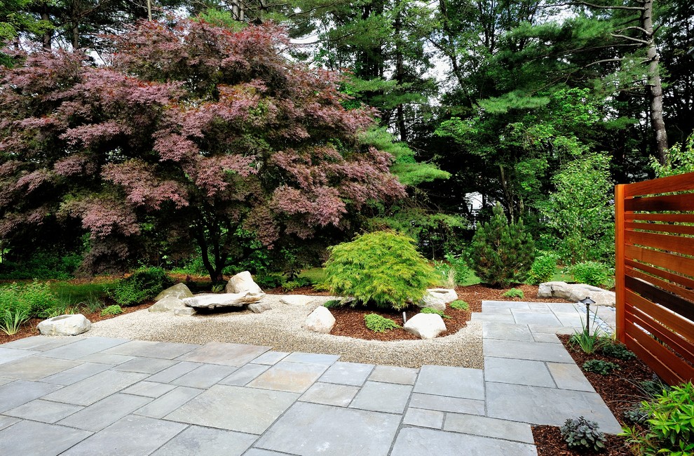 Mid-sized asian side yard patio in Boston with natural stone pavers and no cover.
